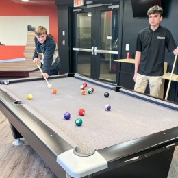 two guys playing pool