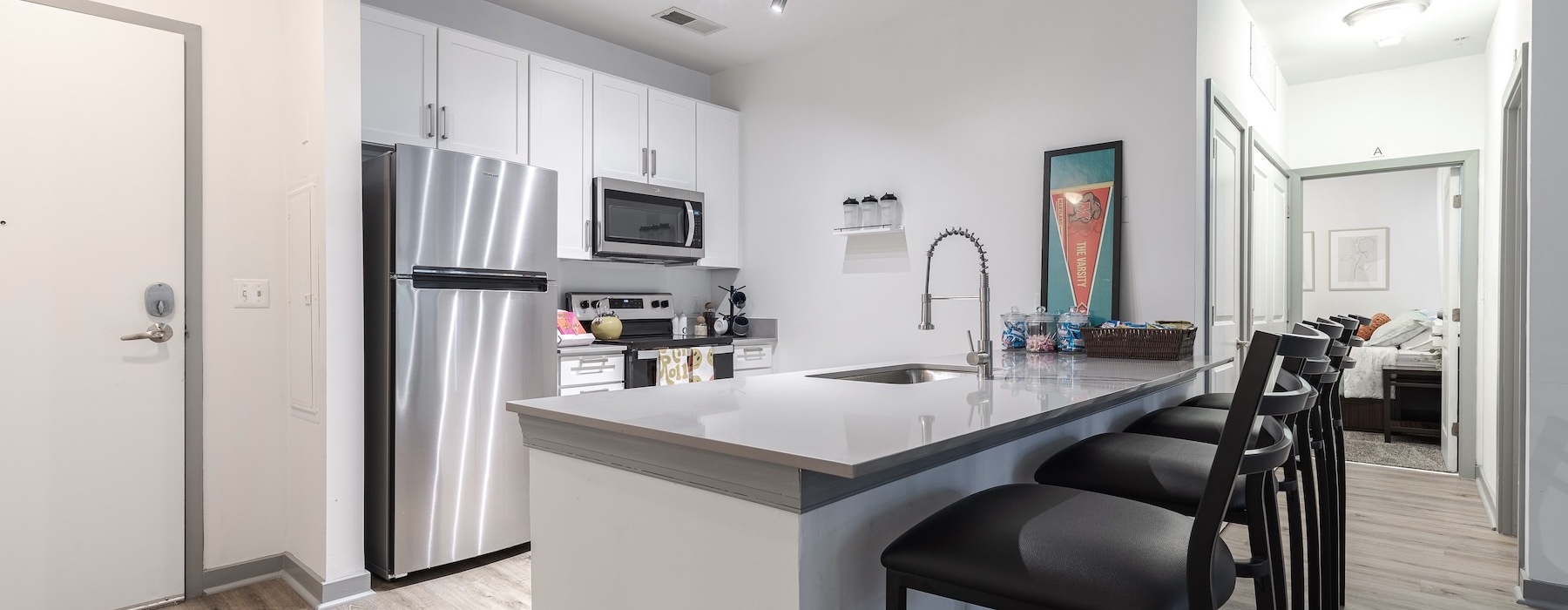 a kitchen with white cabinets